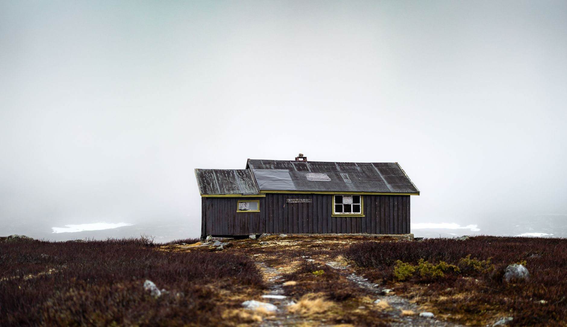 Quiet wooden hut in northern mist
